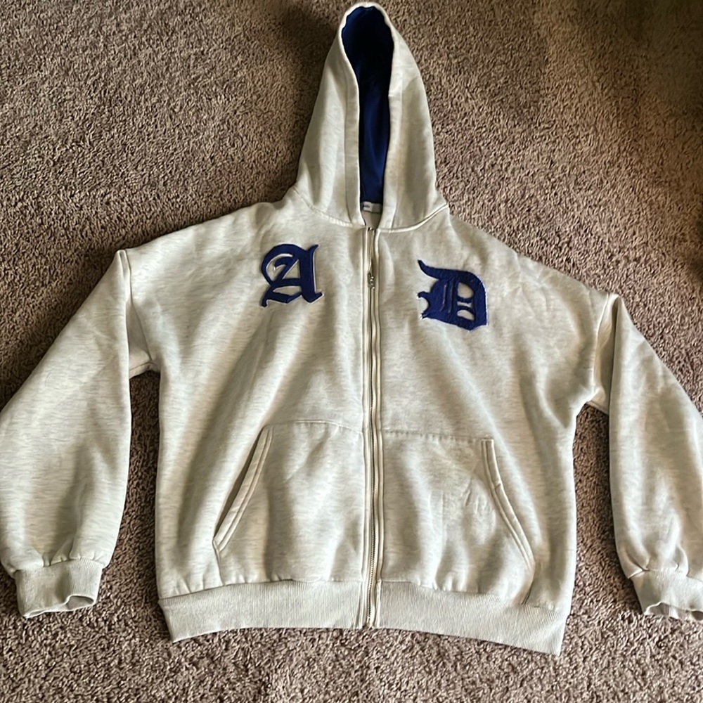 graphic grey and blue Adika sweatshirt.